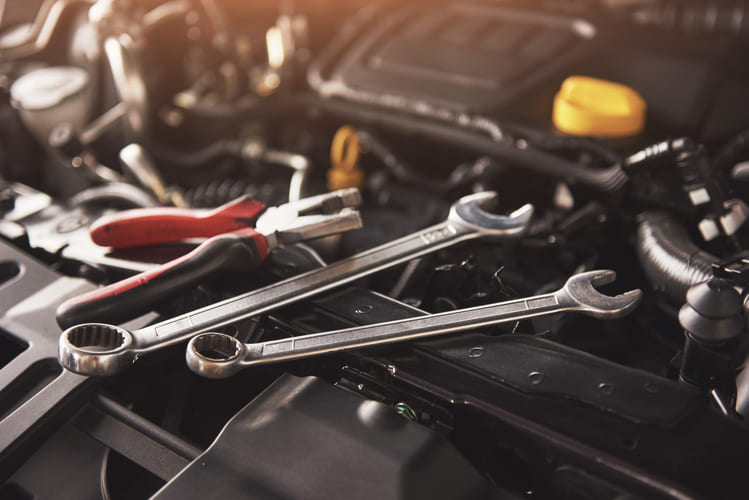 mechanic hand checking fixing broken car car service garage