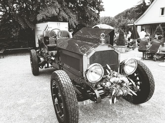 vintage vehicle footpath against trees